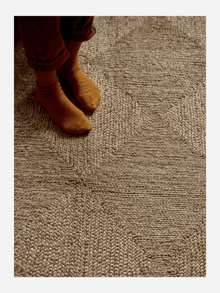 Image may contain: Home Decor, Rug, Baby, and Person